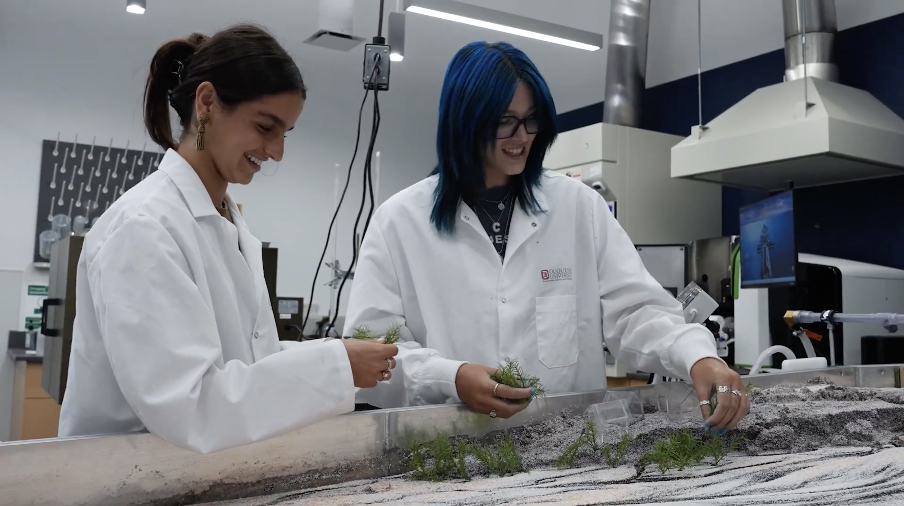 two females in lab coats