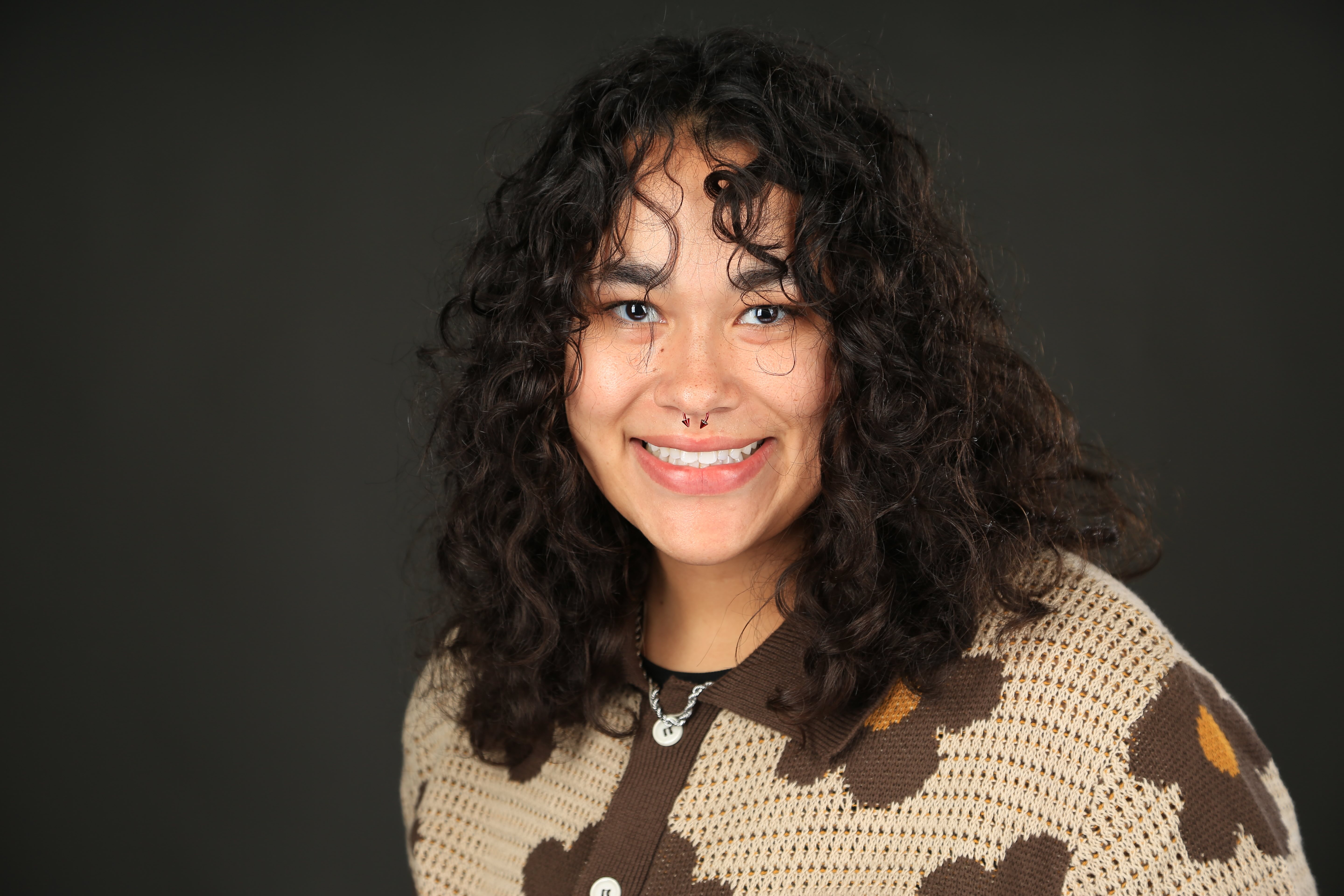 a girl in a floral sweater