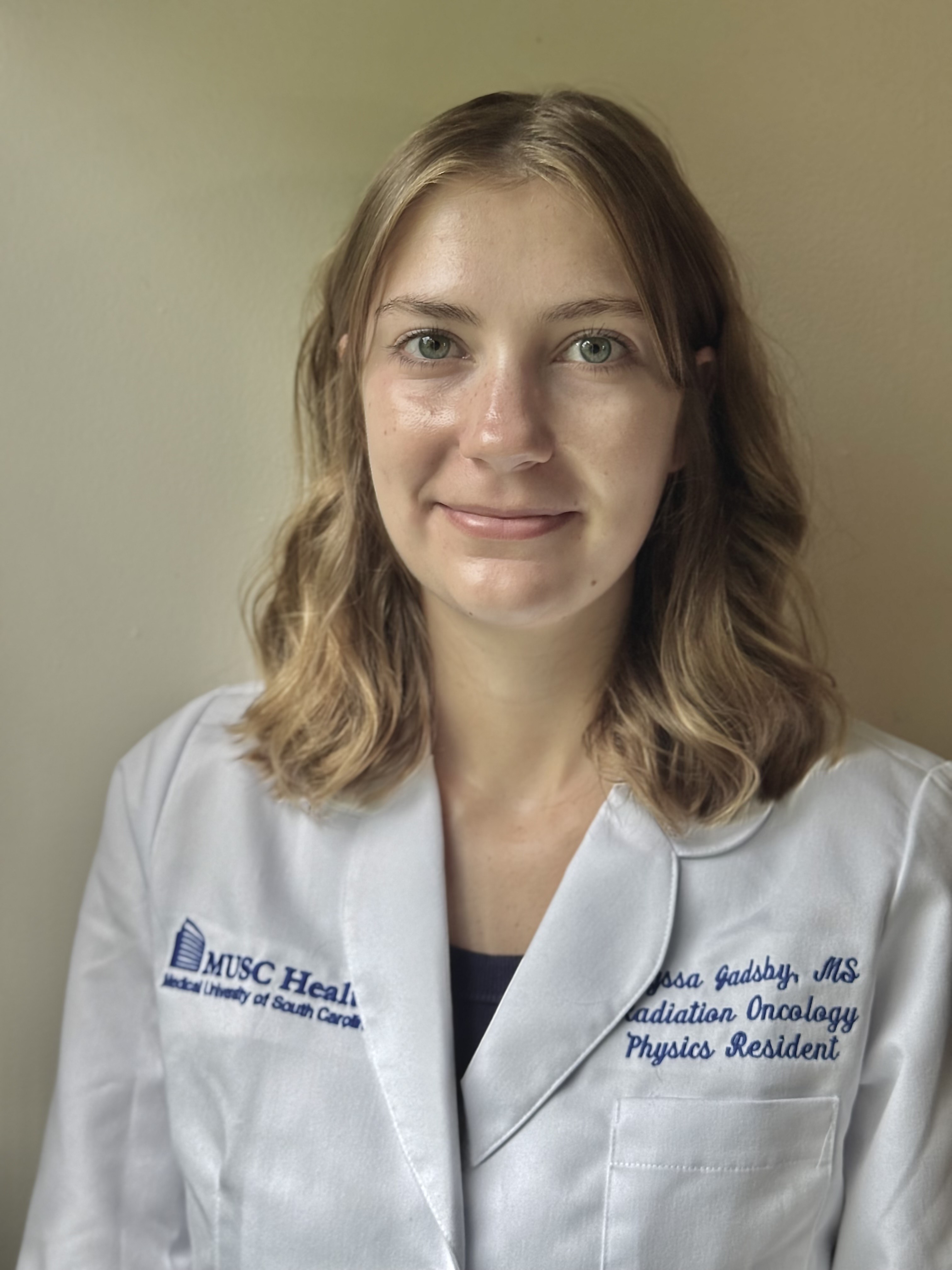 a girl in a white coat