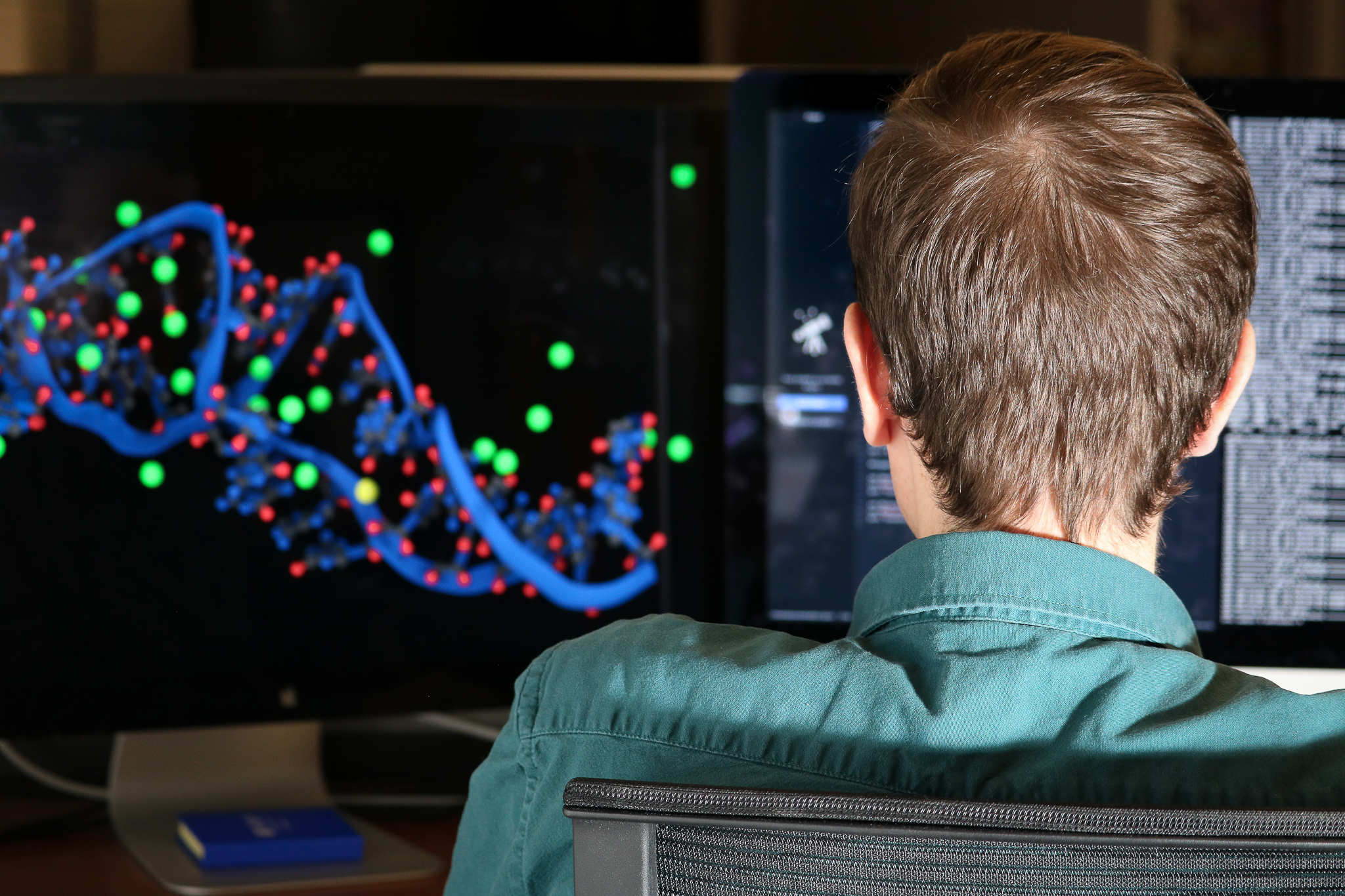 two people looking at a piece of equipment