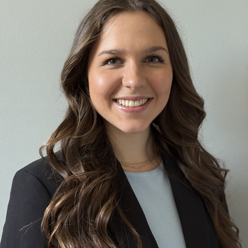 a girl in a blue jacket