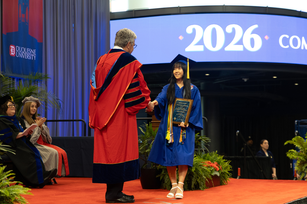 two people in caps and gowns