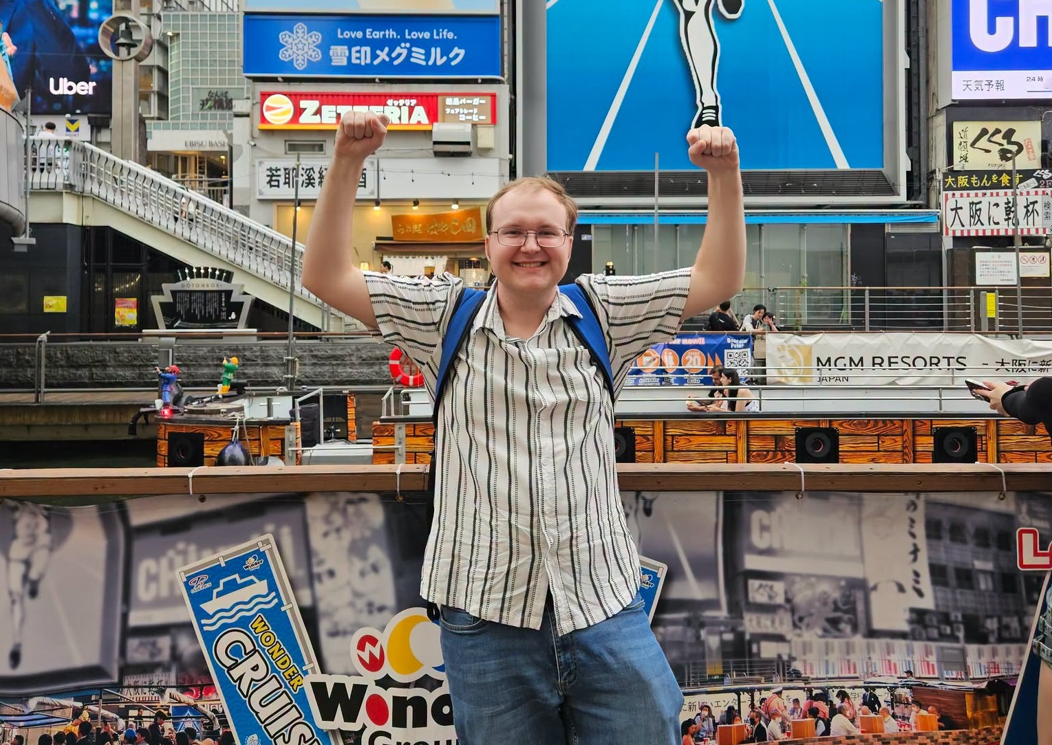 a man holding up his arms