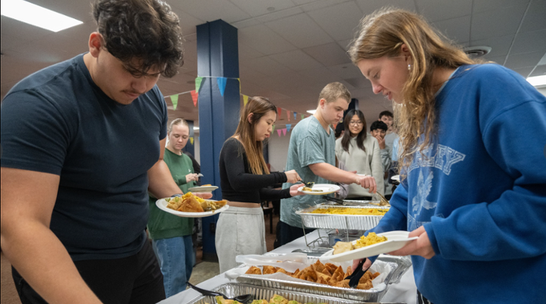 Students dishing a meal