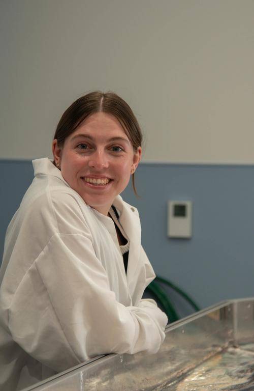 Madison Fitzgerald pointing at a presentation.