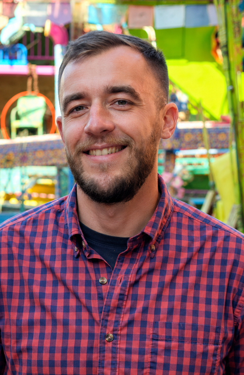 Alek Schrenk headshot. 