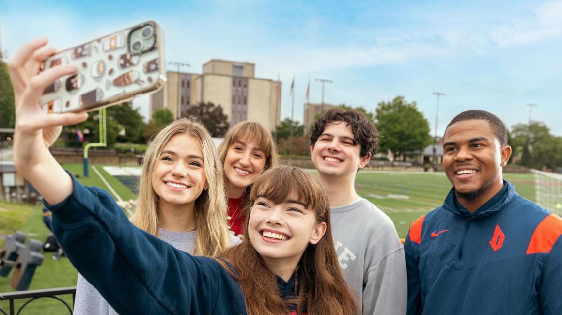 Duquesne students taking a selfie on Rooney Field.