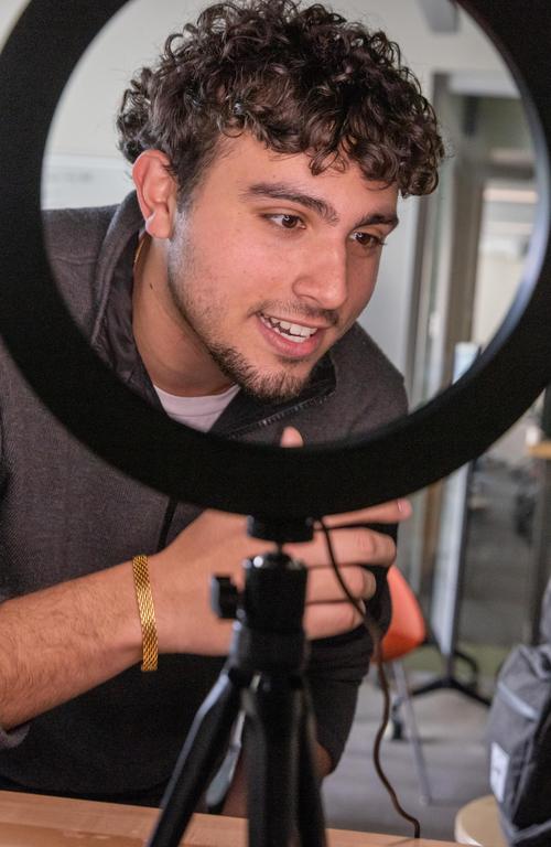 Diego Lopez doing hands-on work in the School of Business