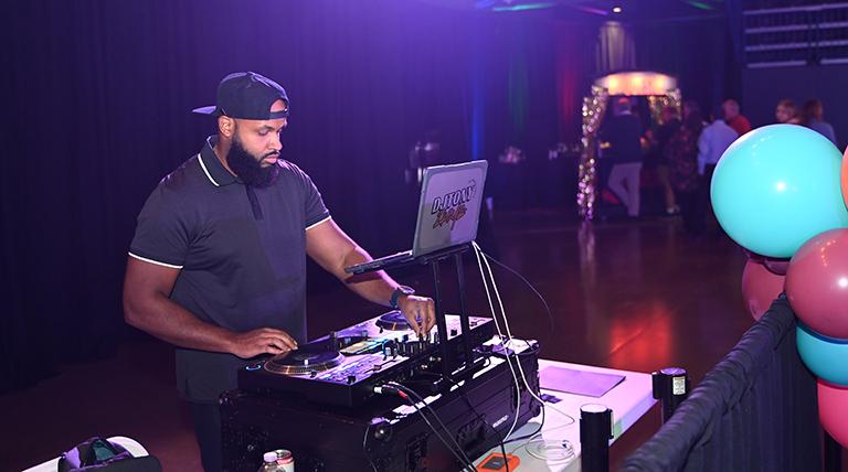 DJ plays music at Homecoming event