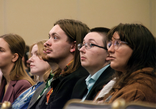 Group at a conference, in the audience. 