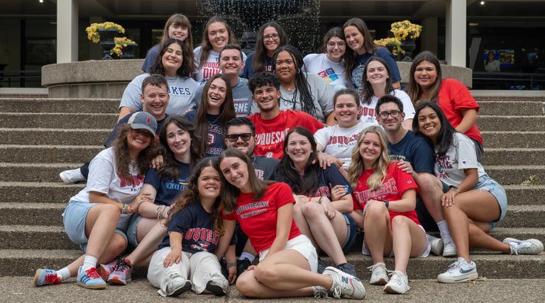 Duquesne Orientation 2025 leaders posing for a group photo on the Union steps