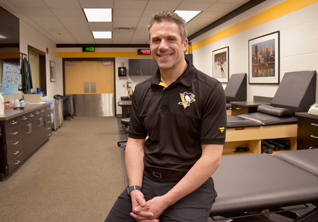 Duquesne athletic training alumnus and Pittsburgh Penguins athletic trainer in training room