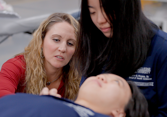 Health sciences faculty working with students in Duquesne's China Health Institute