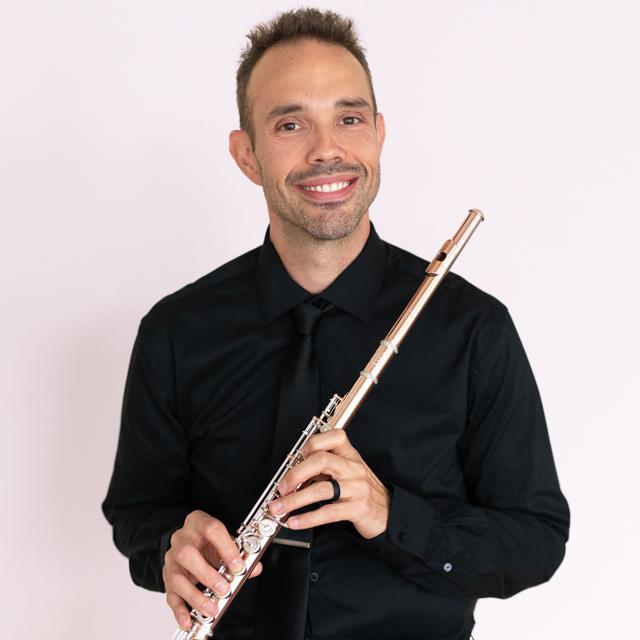 Dan Parasky holds a flute.