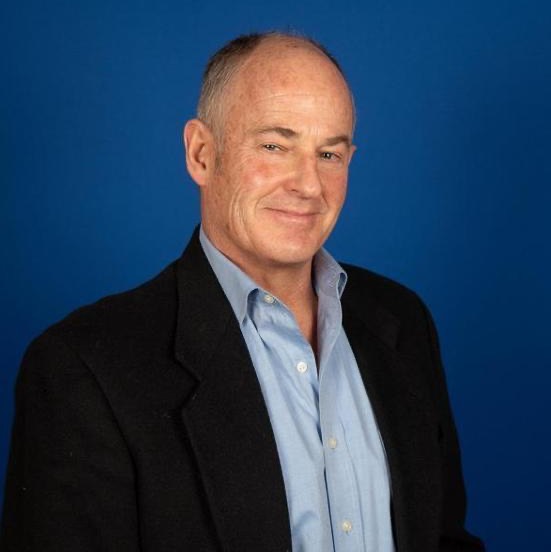 a picture of a male in a blue jacket with a blue background