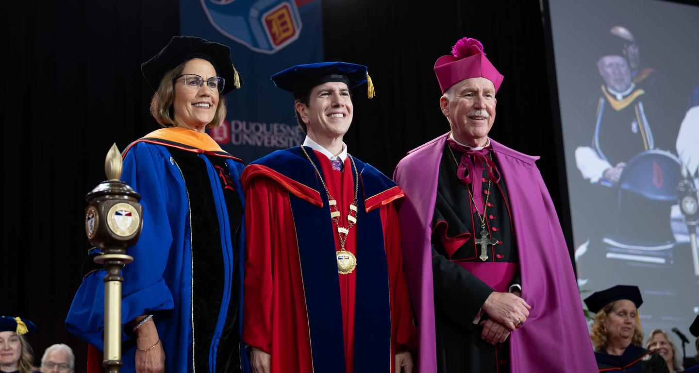 David Dausey with Diane Hupp and the bishop at inauguration.