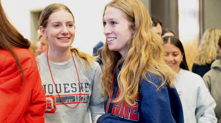 students chatting on campus