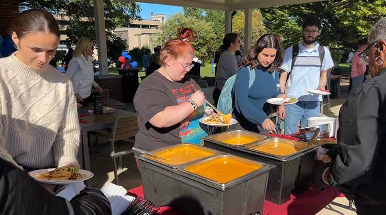 Students eating buffet at Unico Pavilion