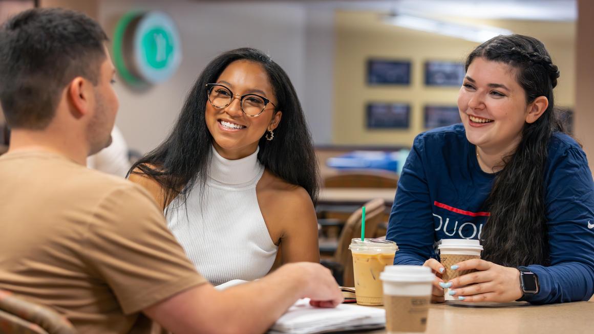 Duquesne Kline law students talking and drinking coffee