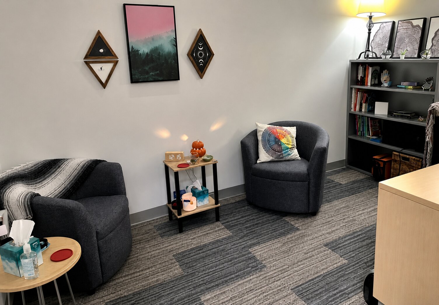 Private therapy office with 2 chairs and relaxing decor.