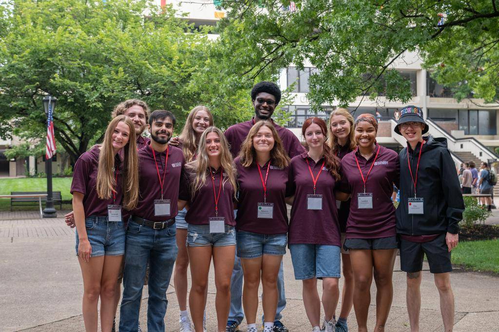 Duquesne's 2025-26 commuter assistants standing in front of the football field.