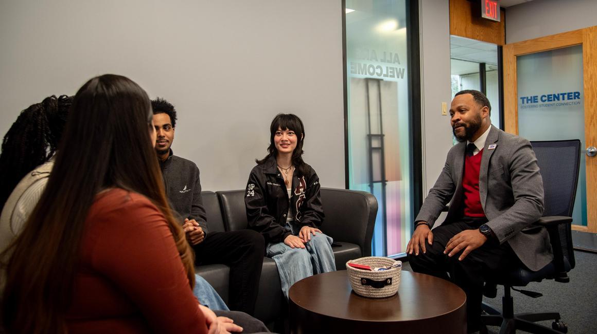 Quincy Stephenson talking with students at The Center.