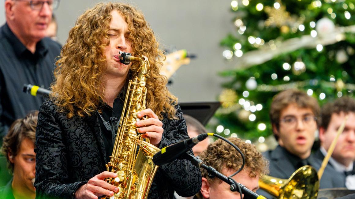 Gabe Pecar playing saxophone in concert