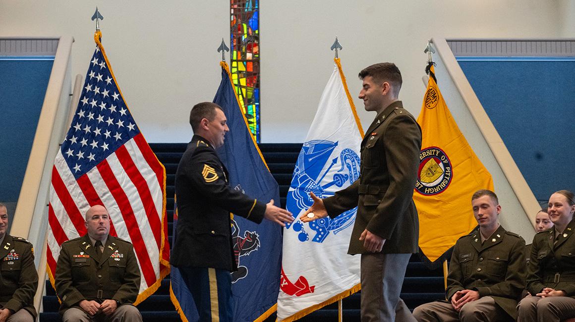 Zach Marini shakes hands at the Army ROTC Commissioning Ceremony on May 13, 2024. 