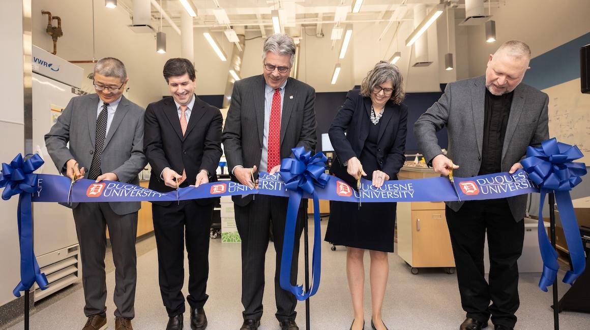 Adminstrators cut ribbon on new lab