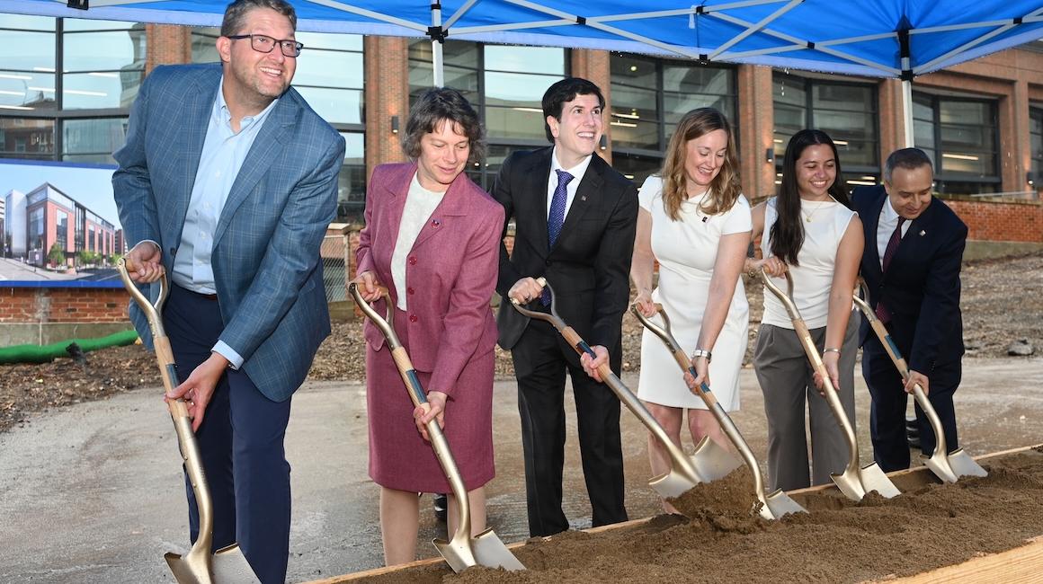 Group breaking ground at building site