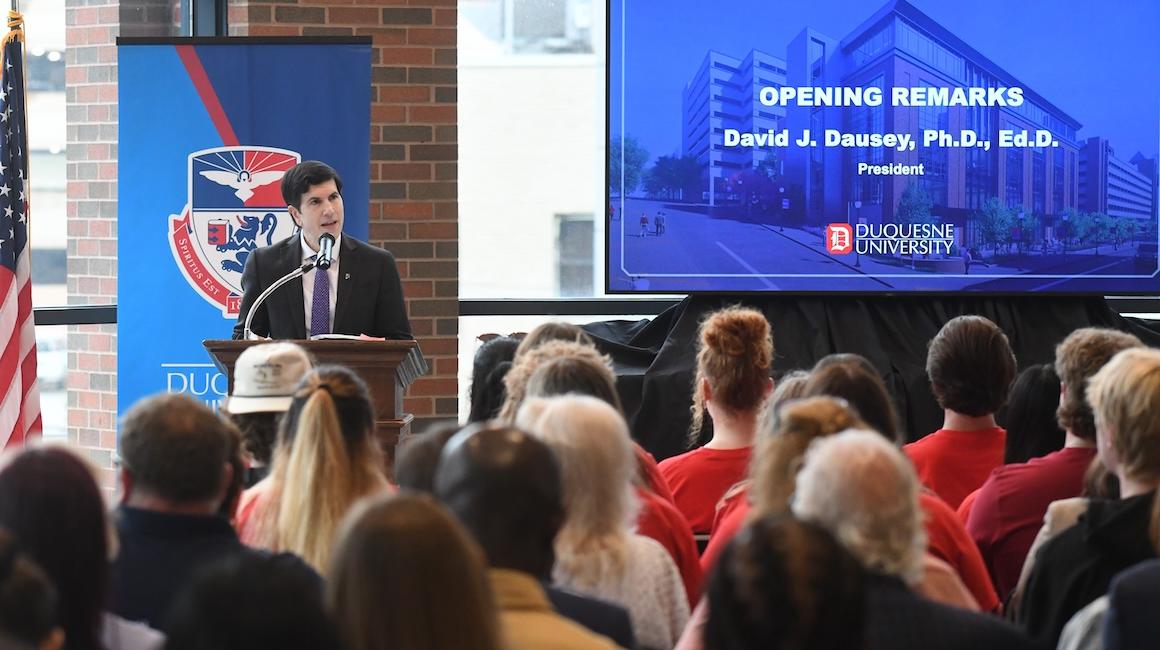 David Dausey addresses audience at ceremony
