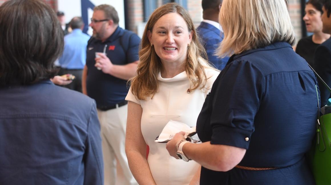 Provost Sarah Ewing talks with attendees