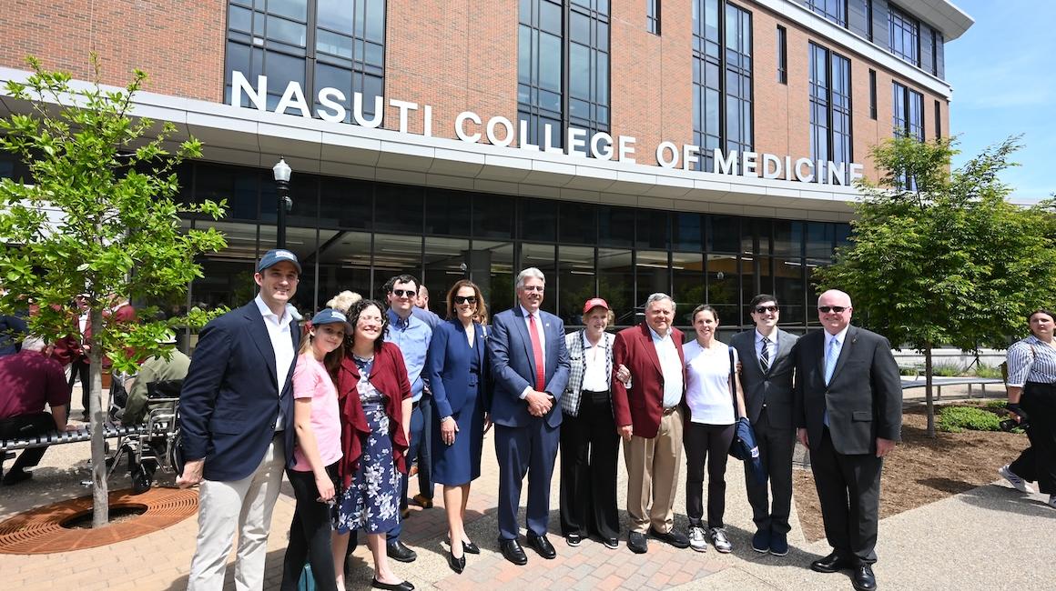 Nasuti family in front of medical college building