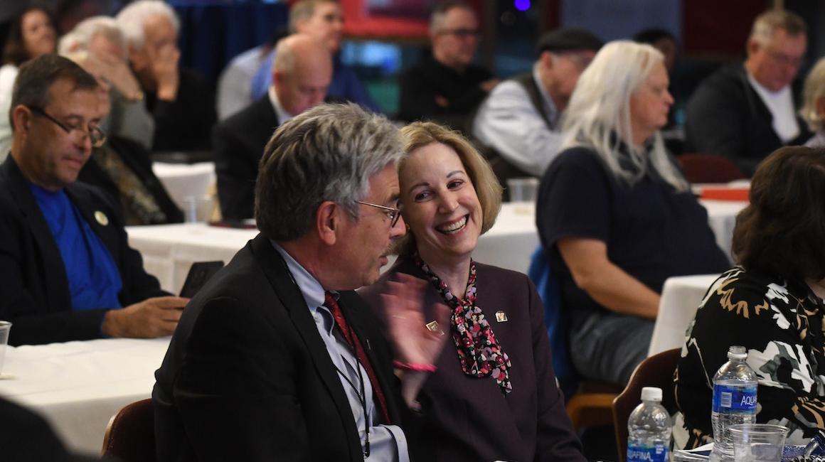 President Ken Gormley speaks with an attendee at the event