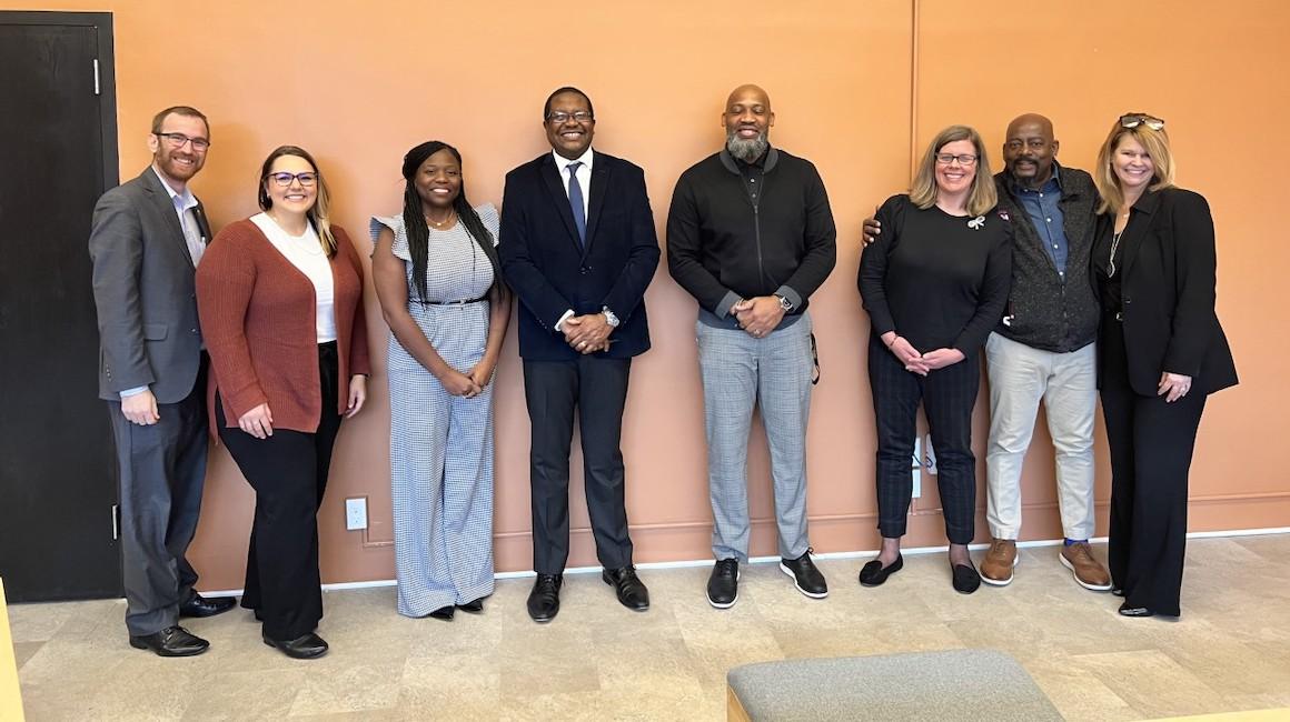 Duquesne staff and faculty standing with Nyree Campus partners.