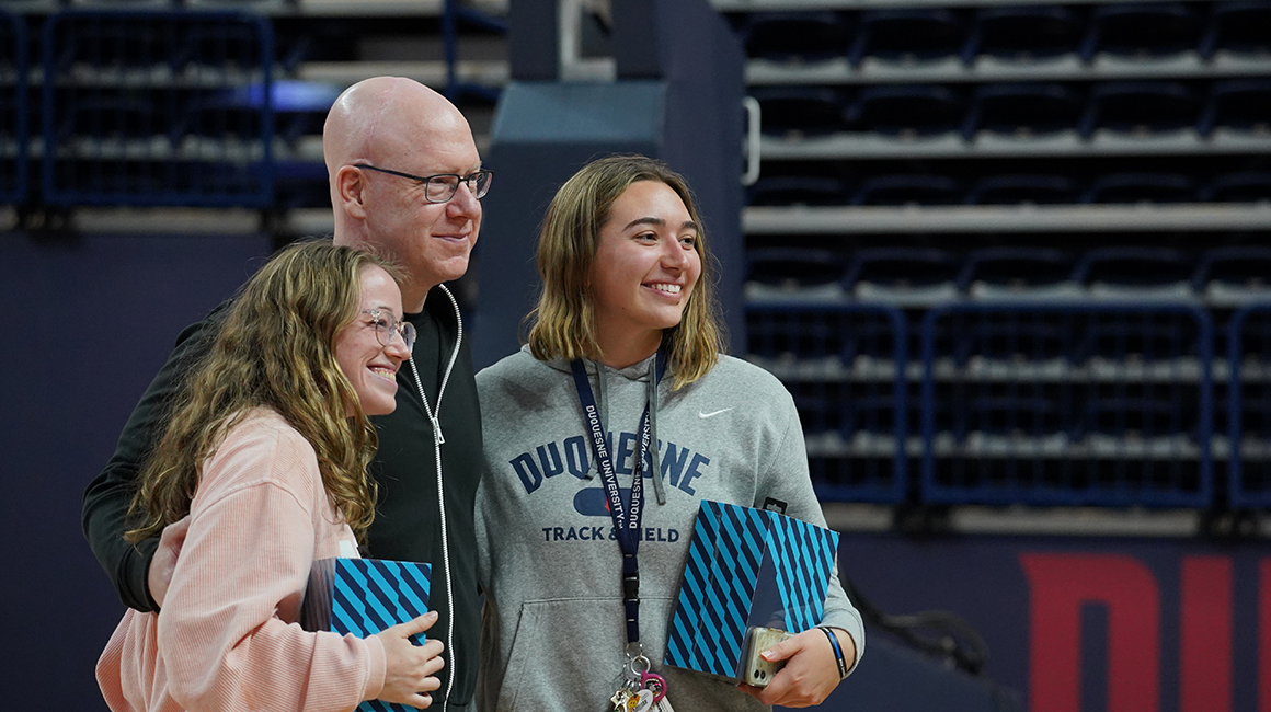 Matthew Costello with two students that he gave Beats to.