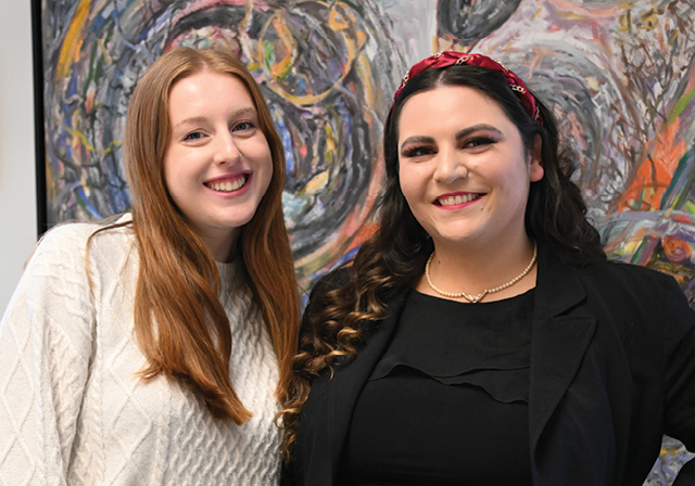 Alumni Taylor Goodman and current student Caroline Denholme meet before Duquesne's spring career fair