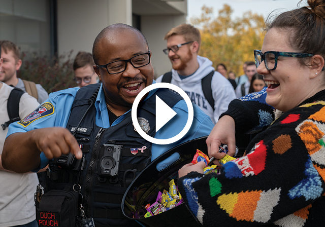 Public Safety Officer interacts with students on campus