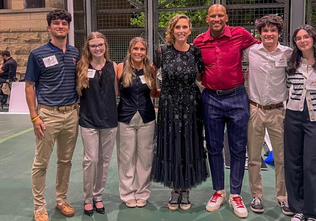 Liberal Arts student Leila Doran stands with classmates and former Pittsburgh Steeler Ryan Shazier at a fundraising event.