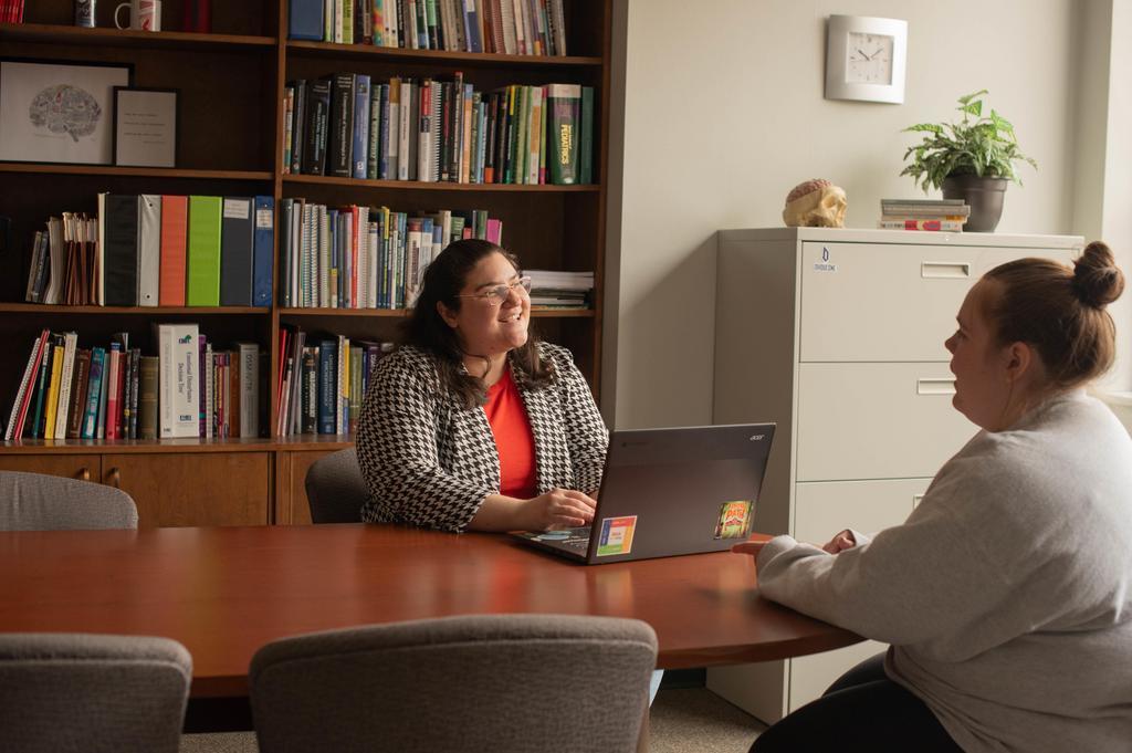 Athena Vafiadis sits across the table from a classmate.