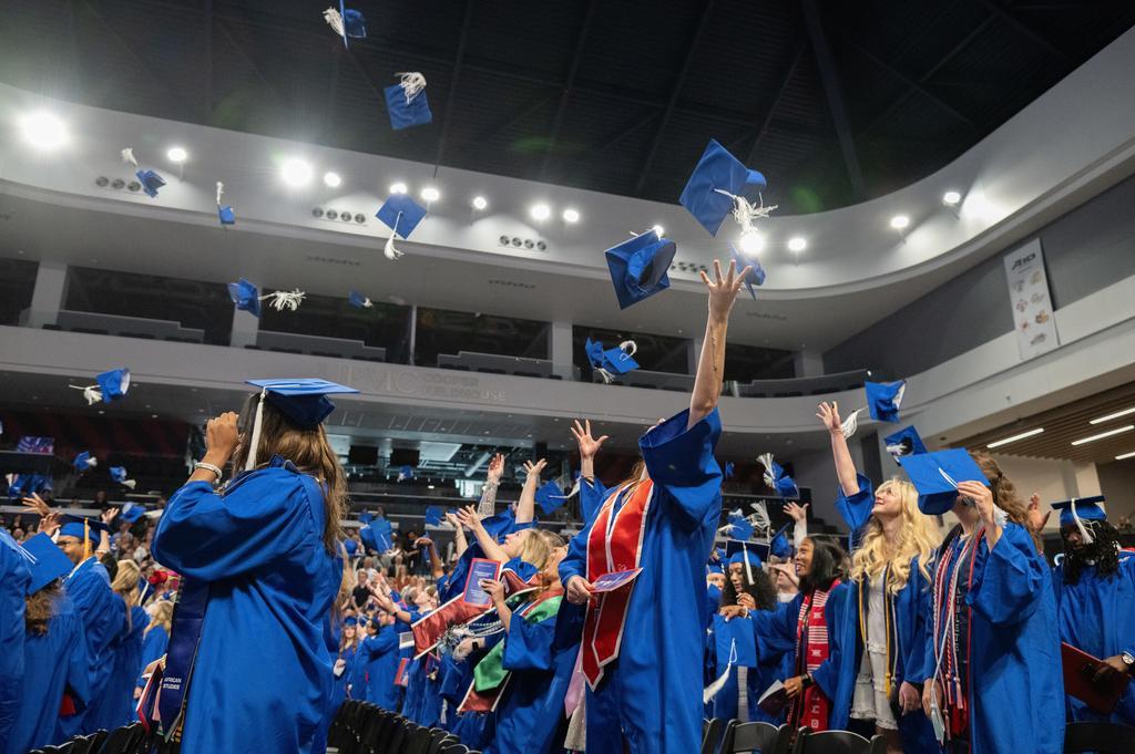 May 2024 graduates throw their caps