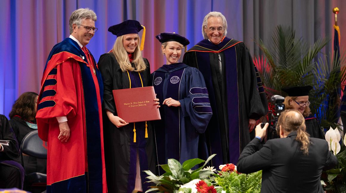 President Gormley, Dean Barton and Student at Commencement