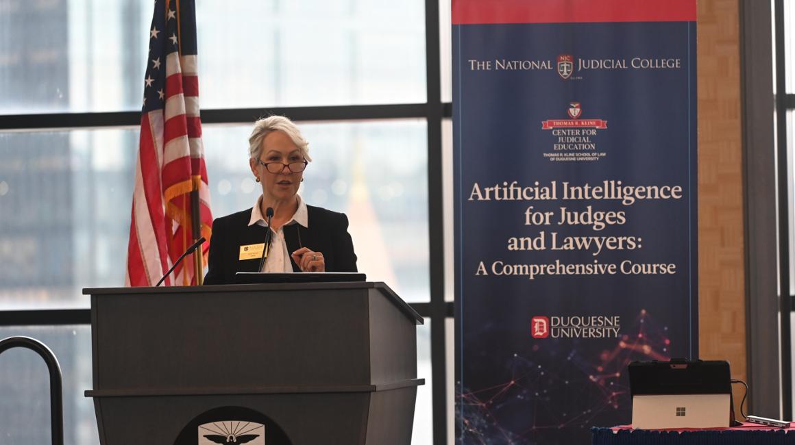 Law Dean April Barton at Podium Speaking