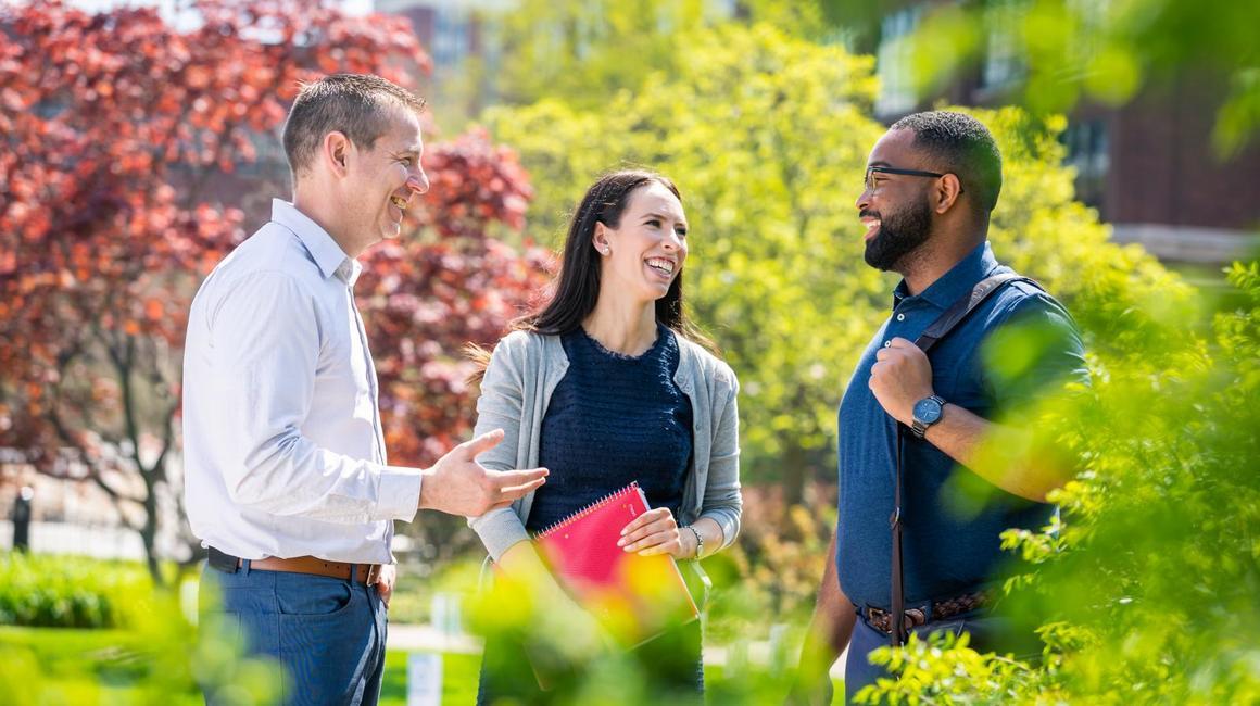 students on campus smiling