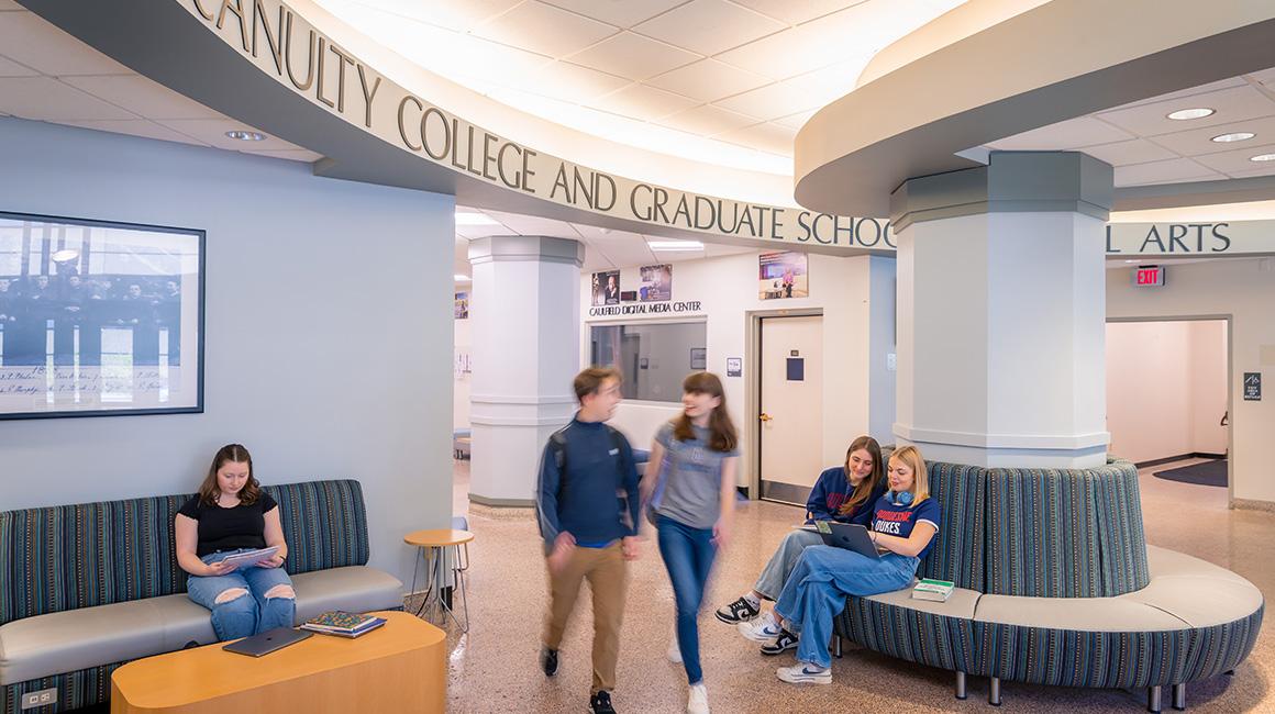 Students walk through the lobby of College Hall