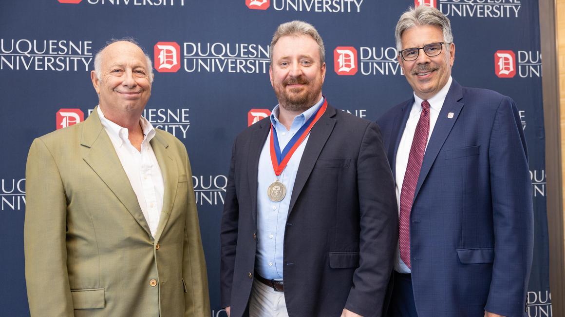 Dr. John Mitcham stands with President Ken Gormley after he is announced the inaugural Albert C. Labriola Chair