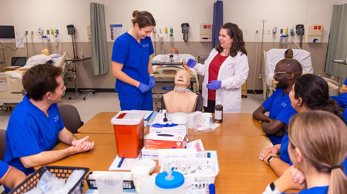 Duquesne nursing students learning n the nursing simulation lab