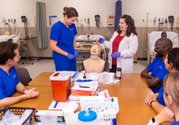 Students work together in the nursing simulation lab