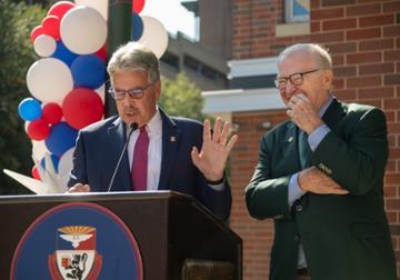 President Ken Gormley and Jack McGinley at podium