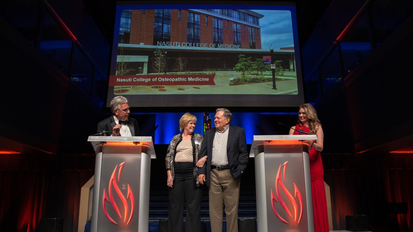 President Gormley introduces the Nasuti family on stage at the Spotlight Dinner.